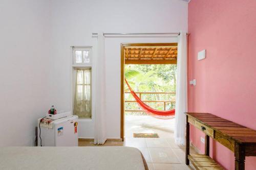 En eller flere senge i et værelse på Suites da Ana