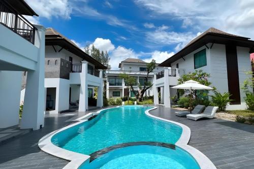 an image of a swimming pool in a villa at Na Napa Wellness Spa & Resort in Chiang Mai