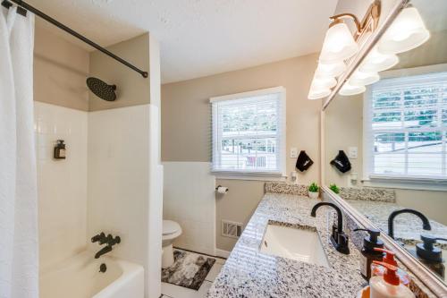 a bathroom with a sink and a tub and a toilet at A good vibe state of mind II in Jonesboro