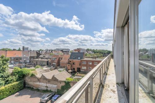a view of a city from the balcony of a building at Value Stay Residence Mechelen in Mechelen