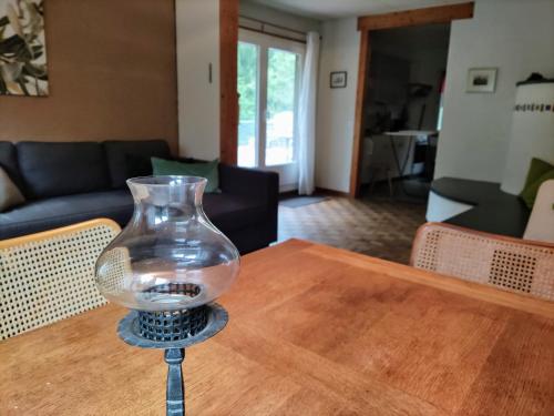 a glass vase sitting on top of a table at Ferienhaus Bärschwendi in Lungern