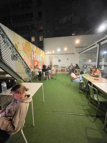 a group of people sitting at tables in a room at WOT Lisbon Patio in Lisbon