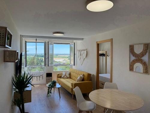 a living room with a couch and a table at Apartamentos Go Buenavista- Tordesillas in Tordesillas