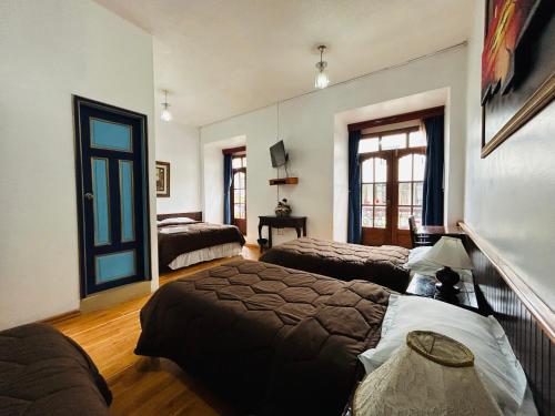 Postel nebo postele na pokoji v ubytování Hotel Montecarlo