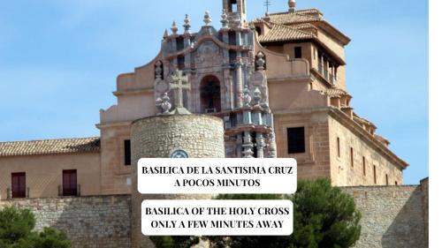 a building with signs on the front of it at Apartamento Completo Lonja Centro in Caravaca de la Cruz