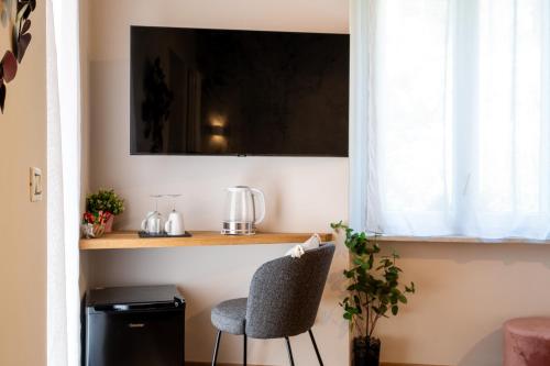 Cadamare charming rooms in Portovenereにあるテレビまたはエンターテインメントセンター