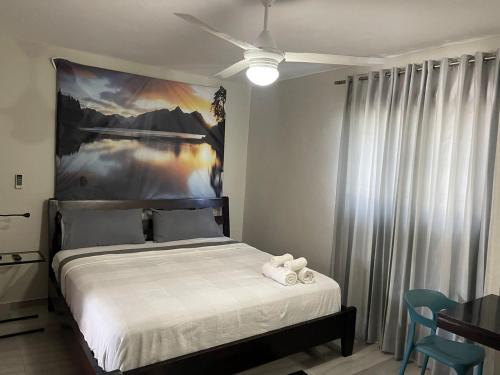 Postel nebo postele na pokoji v ubytování Hotel Casa Jum