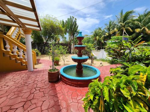 a fountain in the middle of a brick yard at Caribbean Shores Belize in Hopkins