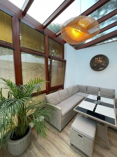 a living room with a couch and a table at Apartmány Kašper in Levoča