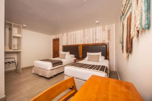 Postel nebo postele na pokoji v ubytování Hotel La Casa de Don Tomás