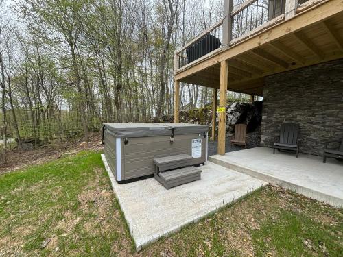 a large outdoor area with a grill and a patio at Big and Boulder in McHenry