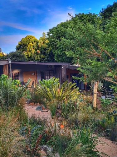a house with a garden in front of it at The Elements in Graskop