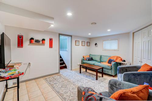 a living room with a couch and a tv at Cozy Home Sleeps 10 Lombard Chicago Suburb in Lombard