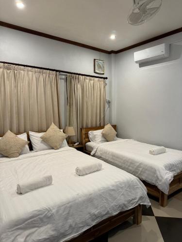Postel nebo postele na pokoji v ubytování Sabai Sabai Luang Prabang Hostel