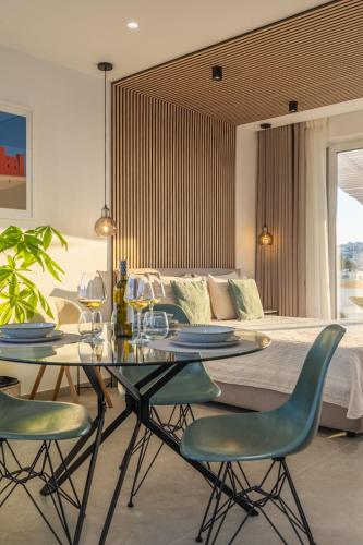 a dining table and chairs in a room with a bed at Penthouse in Mellieha with Private Pool & Large Terraces in Mellieħa