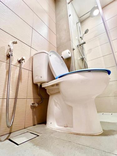 a bathroom with a toilet with a shower at Legoland-3mins Drive KUROMI FAMIY SUITE in Iskandar Puteri