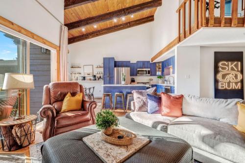 a living room with a couch and chairs at Ski Town Chalet in Steamboat Springs
