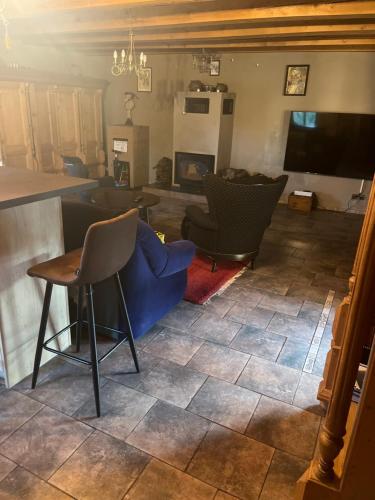 a living room with a blue couch and chairs at Gregor in Pravonín