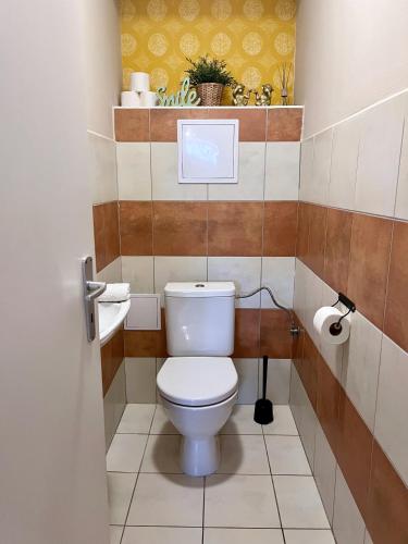 a small bathroom with a toilet in a room at Apartmány Nad ZOO in Plzeň