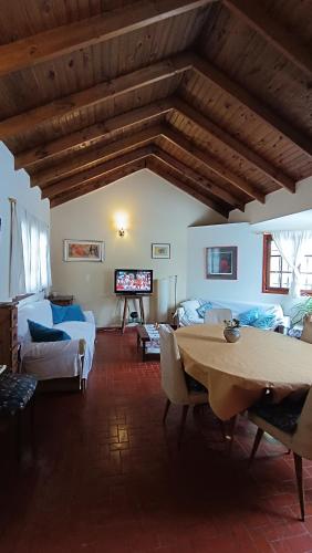 a living room with a table and a couch at la colina 2 in Ushuaia
