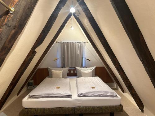 a bedroom with a bed in a tent at Schiefes Haus in Ulm