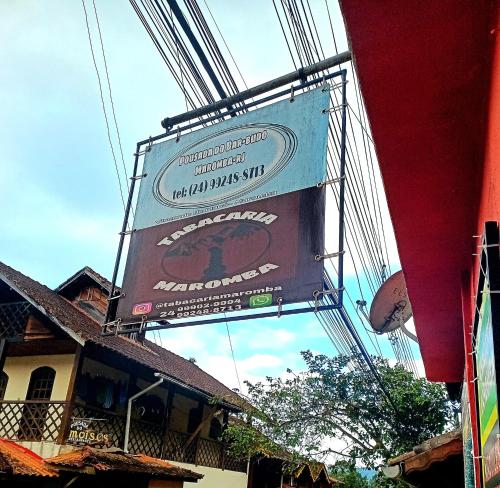 a sign for a restaurant on the side of a building at POUSADA DO BAR- BUDO in Visconde De Maua