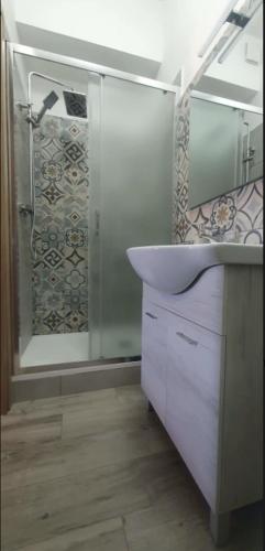 a bathroom with a sink and a shower at Hello Roma B&B in Rome