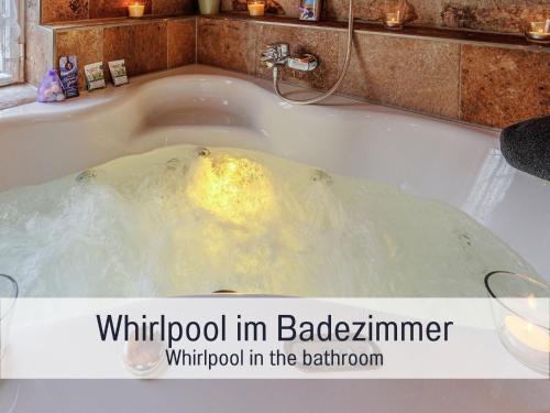 a bath tub filled with water with a yellow substance at Historisches Gerberhaus in Alpirsbach