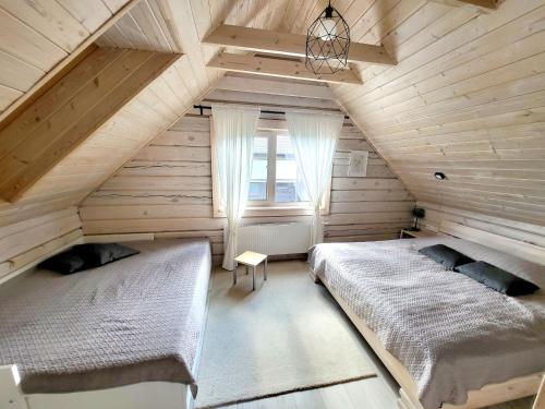 Ένα ή περισσότερα κρεβάτια σε δωμάτιο στο GREY PINE HOUSE