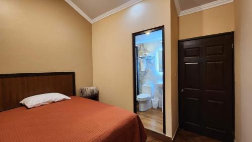 Una cama o camas en una habitación de Grand Tactic Hotel