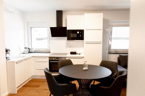 Η κουζίνα ή μικρή κουζίνα στο Aura Apartments