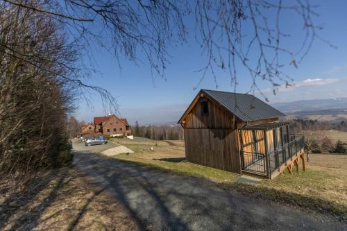 a small building on the side of a road at Widokowa Osada in Międzylesie