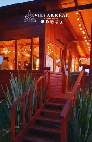 a restaurant with stairs in front of a building at Villarreal Lodge Hotel Ecológico in Totolapan