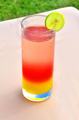 a glass of juice with a lime on a table at The Beach Cabanas Retreat & Spa in Koggala