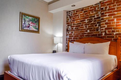 Katil atau katil-katil dalam bilik di Hotel Chateau Bellevue