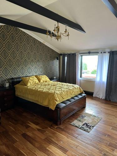 a bedroom with a large bed with a ceiling at Beautiful home with mountain top views with an EV and NEMA connection!! in Poughkeepsie