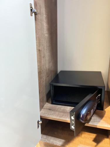 a black console table sitting in a room at Square Boutique Hotel in Baku