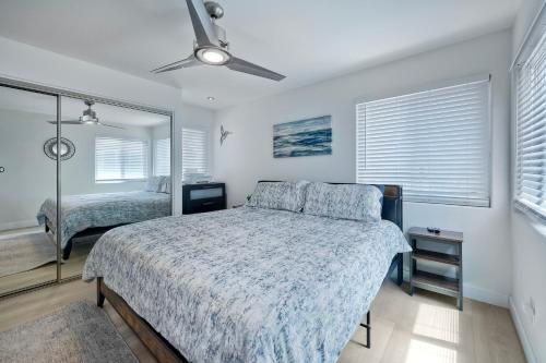 a bedroom with a bed and a ceiling fan at 1128 Tait Street, Unit D in Oceanside