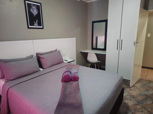 Ένα ή περισσότερα κρεβάτια σε δωμάτιο στο ZUCH Accommodation At Pafuri Self Catering - Comfort Apartment