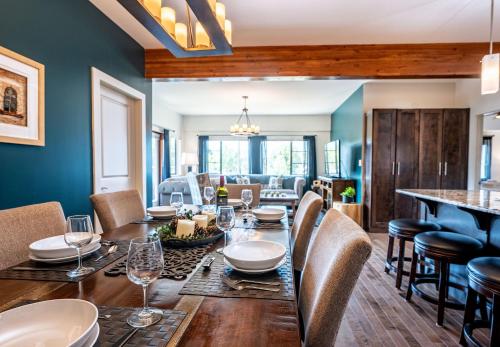 a dining room with a table and chairs and a couch at Downunder Mountain Retreat in Revelstoke