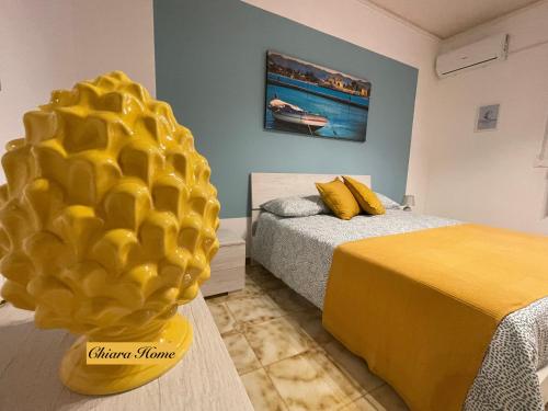 En eller flere senge i et værelse på Chiara Home