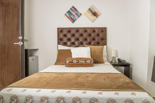Postel nebo postele na pokoji v ubytování Hotel Alamos Del Parque