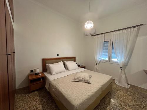 Postel nebo postele na pokoji v ubytování MG elounda apt