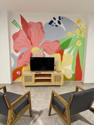 TV a/nebo společenská místnost v ubytování Yvy Porã - Alojamiento Urbano
