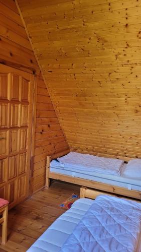 Katil atau katil-katil dalam bilik di Ferienhaus für 4 Personen ca 60 m in Klink-Sembzin, Mecklenburg-Vorpommern Mecklenburgische Seenplatte