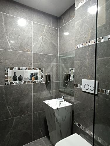 Koupelna v ubytování Hostal Kapital City