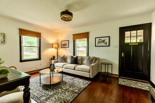 a living room with a couch and a table at Speedway Finish Line House in Indianapolis