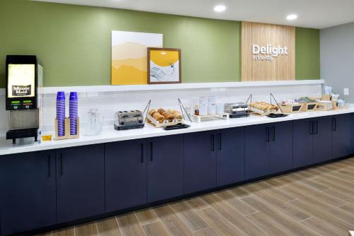 a dental office with a counter with food on it at Spark By Hilton Dallas Medical District Love Field in Dallas