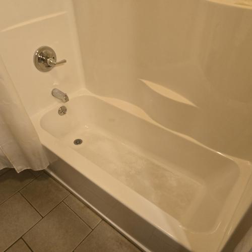 a white bath tub with a silver faucet in a bathroom at Jared's Wild Rose Ranch Resort in Lake