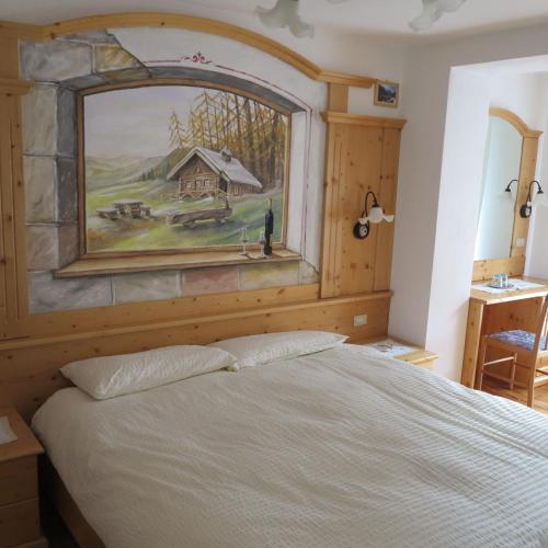 Una cama o camas en una habitación de Hotel Presena